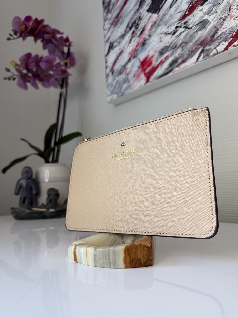 Kate Spade New York beige leather wristlet / pouch